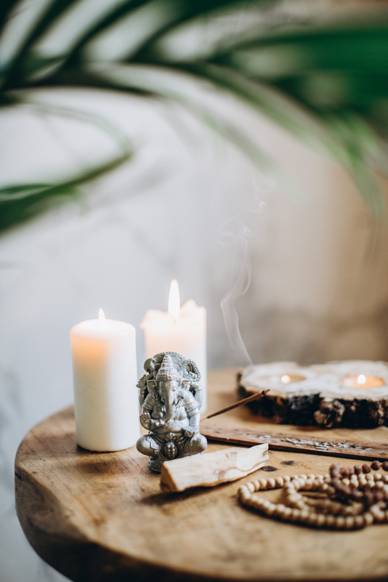 Brown Wooden Table With Candles and Incense